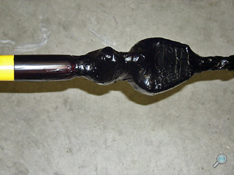 Wire rope termination attached to nylon rope termination, assembly is then wrapped & coated